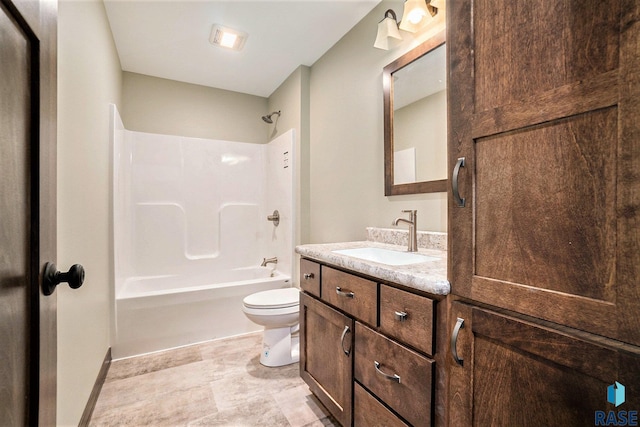 bathroom with shower / bath combination, vanity, toilet, and baseboards