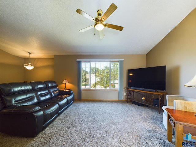 living room featuring a textured ceiling, carpet flooring, ceiling fan, and lofted ceiling