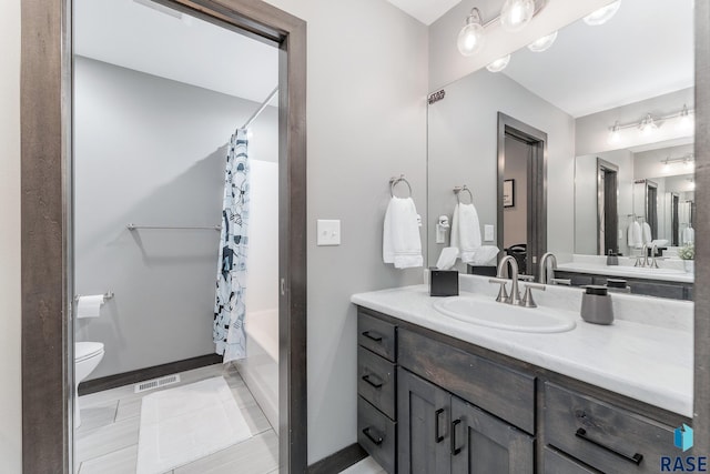 bathroom with shower / bath combination with curtain, visible vents, toilet, vanity, and tile patterned flooring