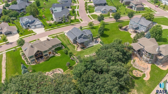 birds eye view of property with a residential view