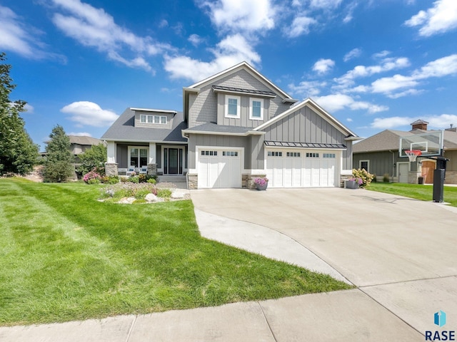 craftsman-style home with driveway, covered porch, board and batten siding, and a front yard