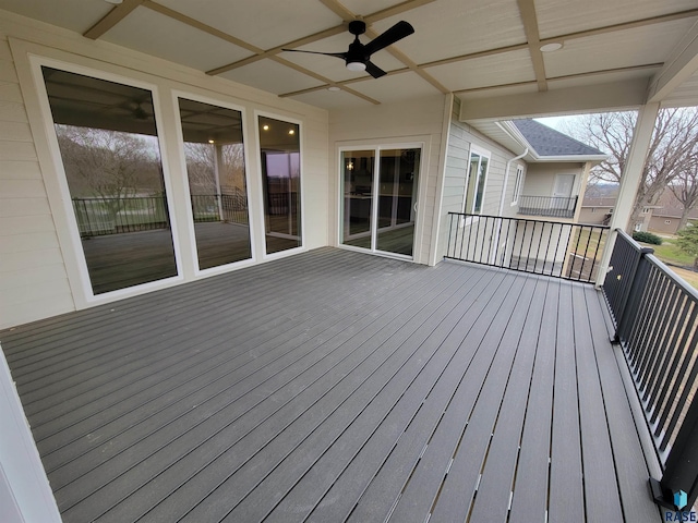 wooden terrace featuring a ceiling fan