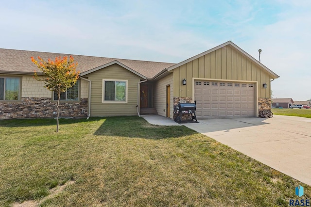 ranch-style home with a garage and a front lawn