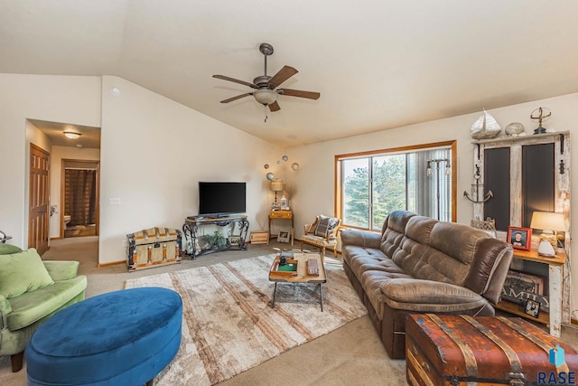 carpeted living room with vaulted ceiling and ceiling fan