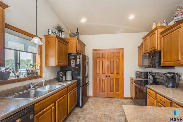 kitchen with lofted ceiling, black appliances, pendant lighting, and sink