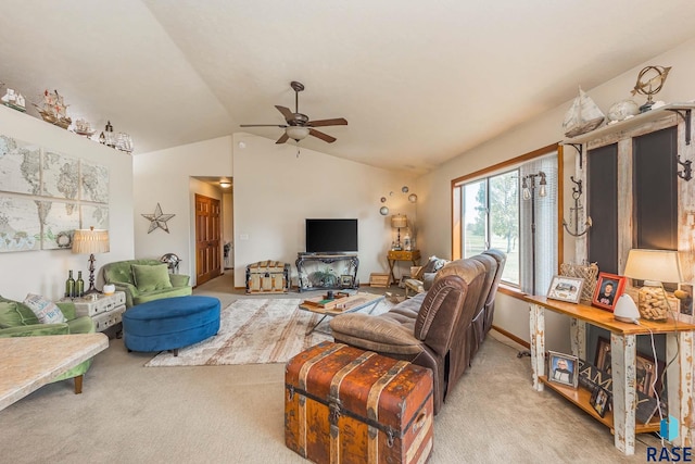 living room featuring ceiling fan, light carpet, and vaulted ceiling