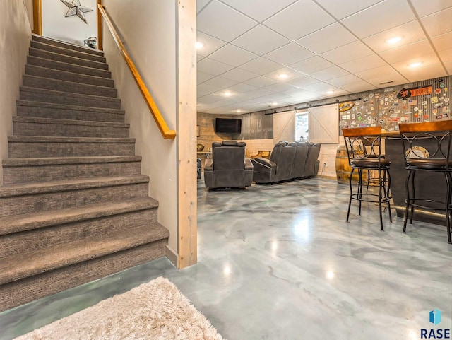 interior space with concrete floors and bar area