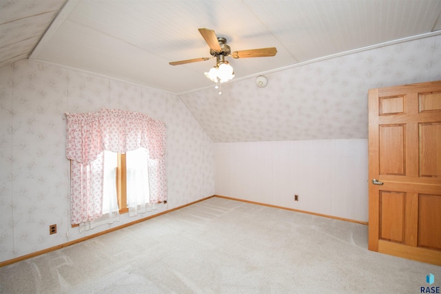 additional living space featuring ceiling fan, carpet, and vaulted ceiling