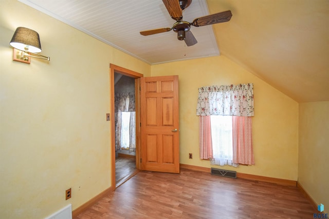 additional living space featuring lofted ceiling, ceiling fan, and wood-type flooring