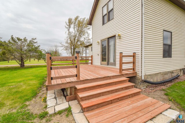 deck featuring a lawn