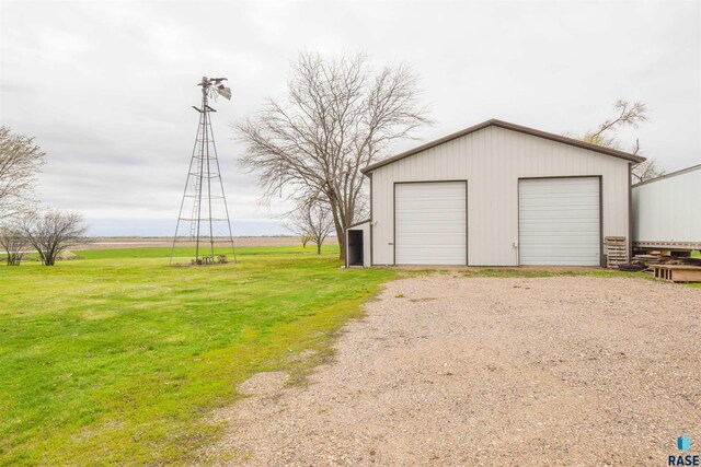 garage featuring a lawn