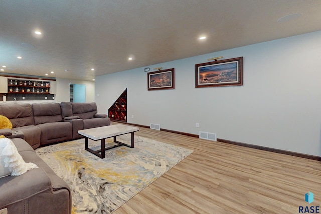 living room with light hardwood / wood-style floors