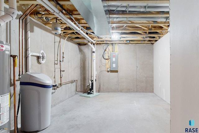 basement with electric panel and gas water heater