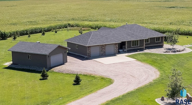 birds eye view of property with a rural view