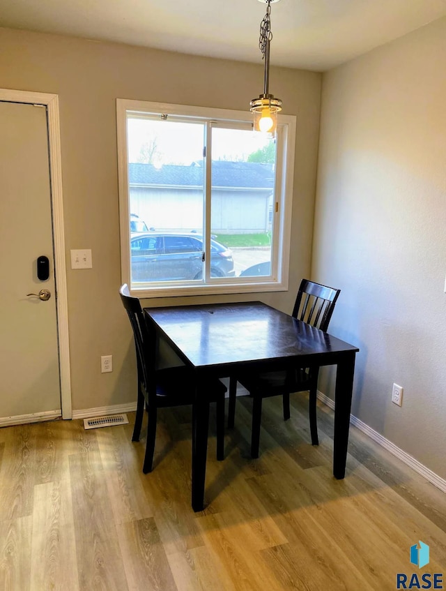 dining area with light wood-type flooring