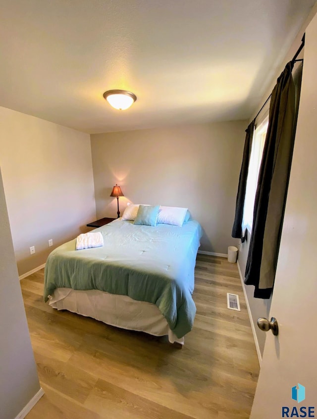 bedroom featuring light hardwood / wood-style floors