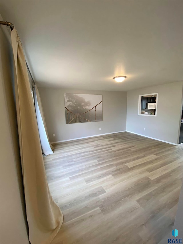 unfurnished room featuring light hardwood / wood-style flooring