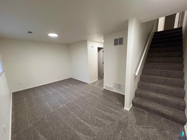 interior space with dark carpet