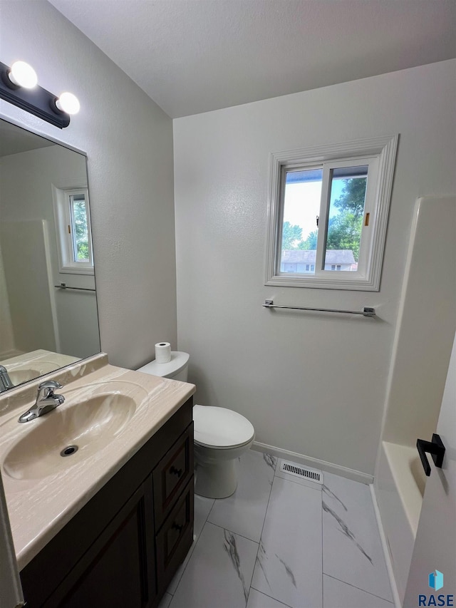 full bathroom featuring vanity, toilet, and independent shower and bath