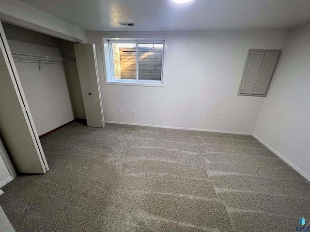 unfurnished bedroom with a closet and carpet floors