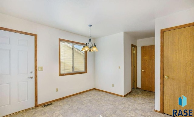 interior space featuring a chandelier