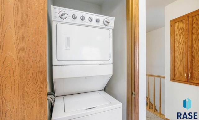 laundry room featuring stacked washer / dryer