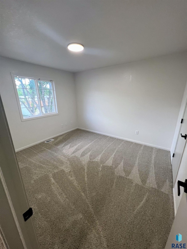 empty room with carpet flooring