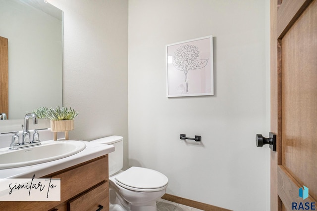 bathroom featuring vanity, toilet, and tile patterned floors