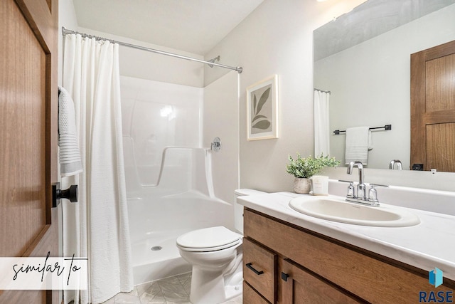 bathroom featuring vanity, toilet, and curtained shower