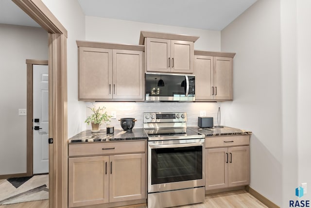 kitchen featuring light hardwood / wood-style flooring, stainless steel appliances, and light brown cabinets