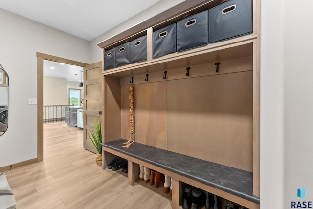 mudroom with hardwood / wood-style flooring