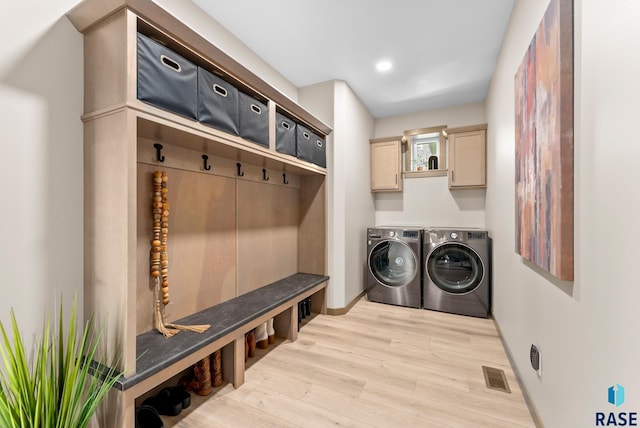 interior space with separate washer and dryer and light wood-type flooring