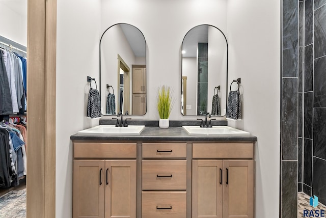 bathroom featuring vanity and a shower