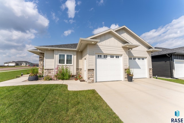 craftsman-style home with a garage and a front yard