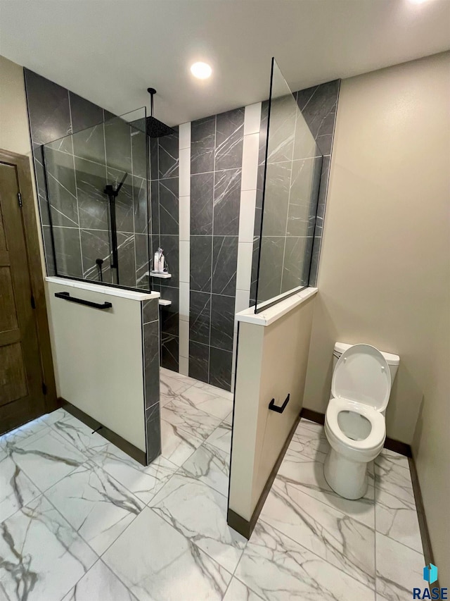 bathroom featuring toilet and tiled shower