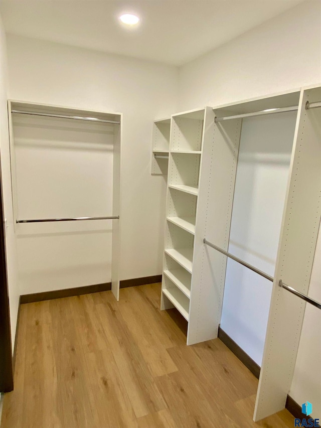 walk in closet featuring light hardwood / wood-style floors