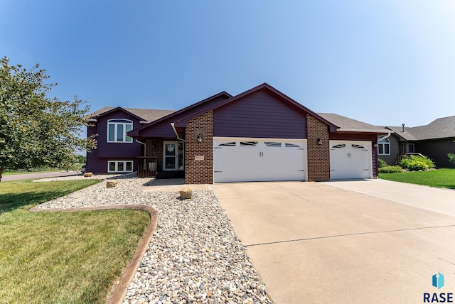 view of front of home with a garage and a front yard