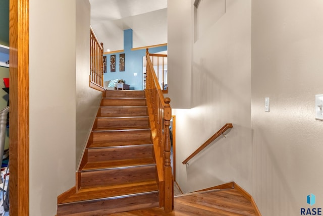 staircase featuring hardwood / wood-style flooring