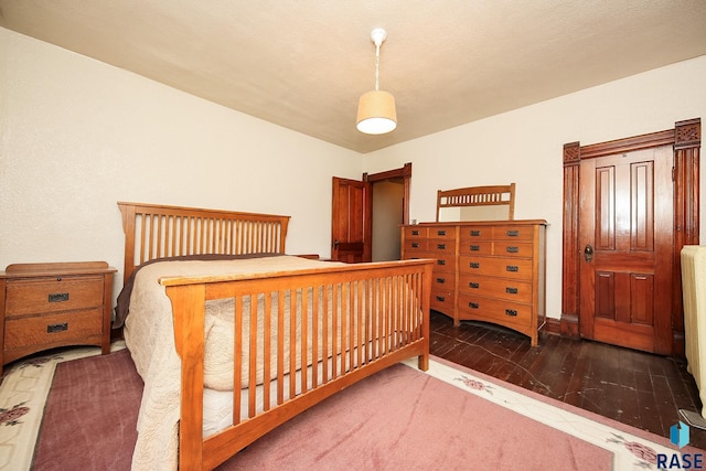 bedroom featuring wood finished floors