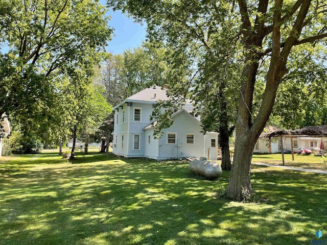 exterior space featuring a front lawn