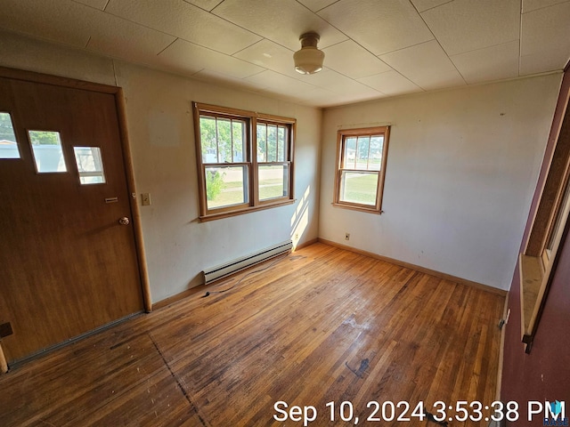 entrance foyer featuring wood-type flooring and baseboard heating