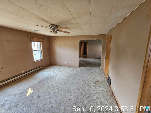 empty room featuring light carpet, a baseboard radiator, and ceiling fan