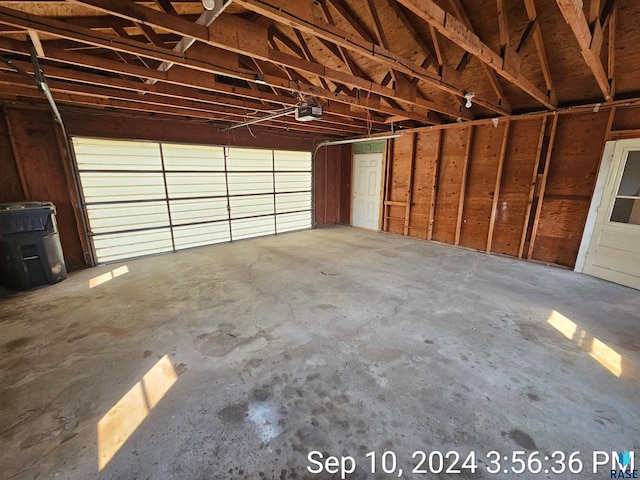 garage featuring a garage door opener