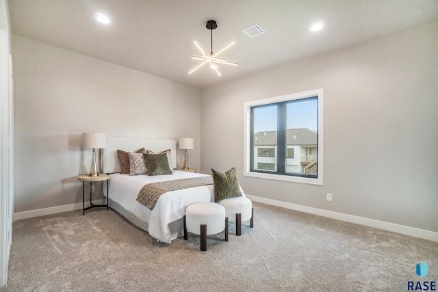 carpeted bedroom with a chandelier