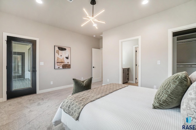 bedroom with access to outside, ensuite bath, light carpet, and a chandelier