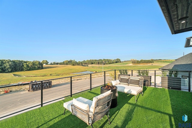 view of yard featuring outdoor lounge area and a rural view