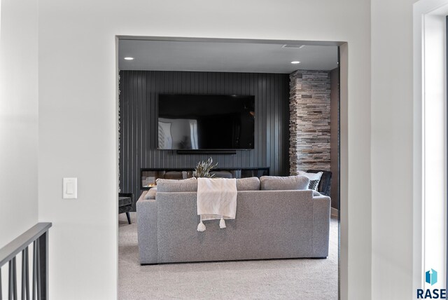 carpeted living room featuring a fireplace