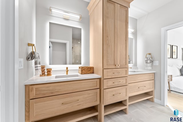 bathroom with vanity and a shower