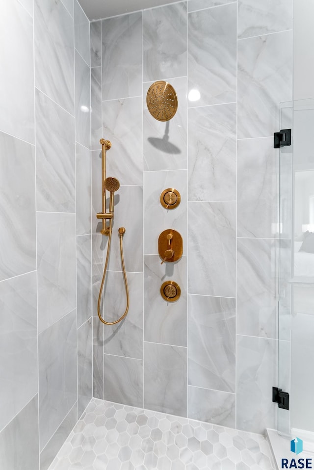 bathroom with a tile shower