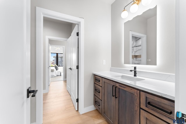 bathroom featuring vanity and hardwood / wood-style floors